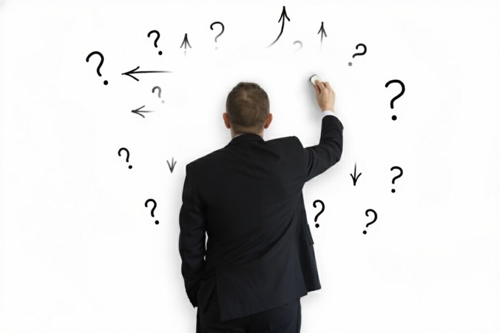 مردی در حال پاک کردن علائم سوال و فلش‌ها؛ نمادی از فرار مغز از تصمیم‌گیری و حذف بار شناختی در اثر خستگی.