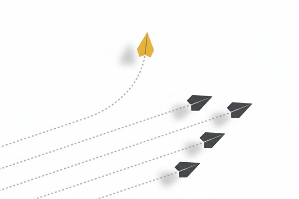 تصویر موشک کاغذی زرد در حال تغییر مسیر از گروه، نماد شکستن الگوهای فکری منفی و یافتن مسیر منحصر به فرد در افزایش اعتماد به نفس.